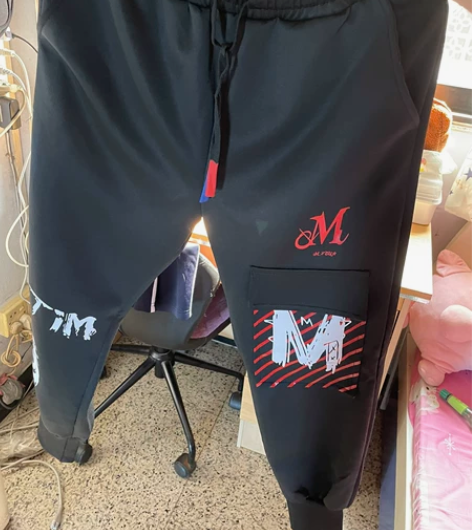 潮牌高街印花束脚裤男休闲拼接发型师宽松男长...
