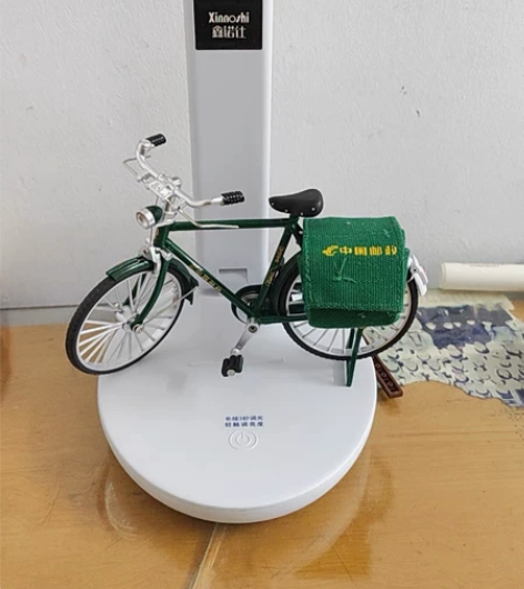 曾经穿行大街小巷的邮政二八大杠自行车，如今...