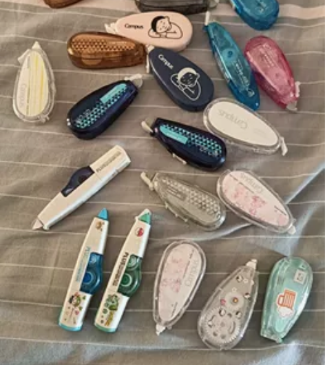 出修正带，有的里面是满的，有的里面是空壳，...