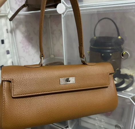 TOGO真皮头层牛皮荔枝纹凯莉包长型腋下包...