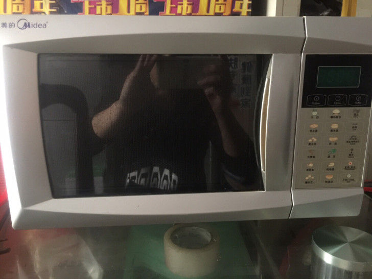 美的微波炉八成新