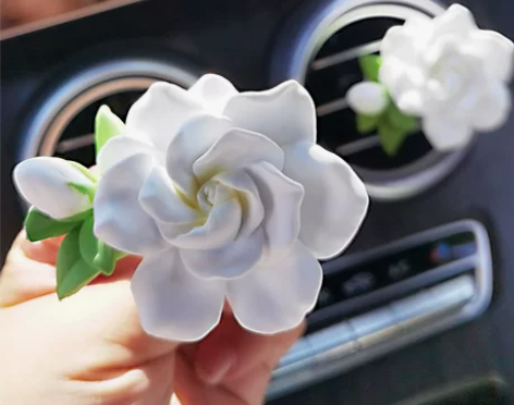 车载香薰栀子花车载扩香石汽车空调出风口香水...