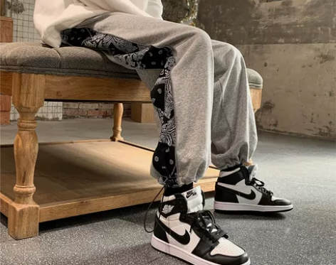 男士休闲裤2021春季潮流嘻哈腰果花拼接运...