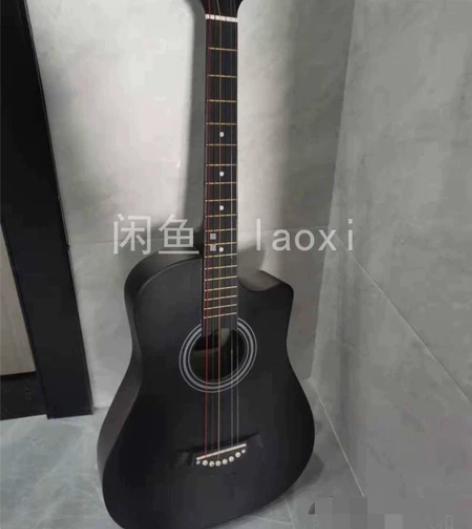 全新 民谣吉他琴行898买的买来就弹了一次...