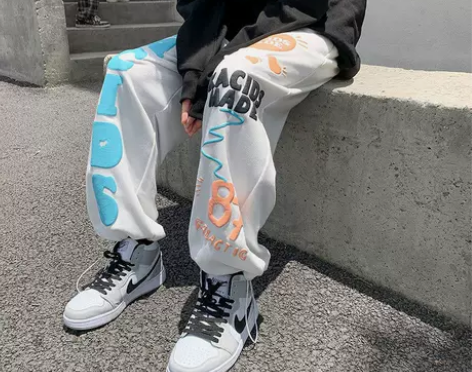 发泡字母裤子男春秋季港风潮流抽绳束脚运动长...