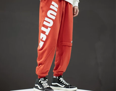 欧美街头针织休闲裤男潮流宽松字母印花束脚哈...