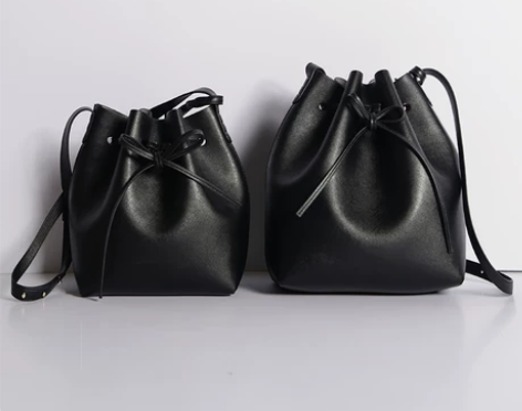 十字纹真皮水桶包女2019新款大容量包包抽...