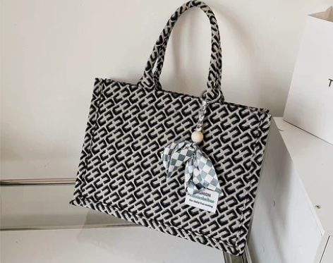 代购包包女2022夏季新款小众提花手提包大...