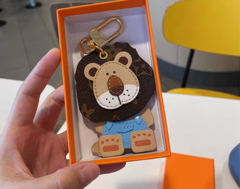 转卖欧美可爱小狮子车钥匙扣挂件卡通摇头老花...