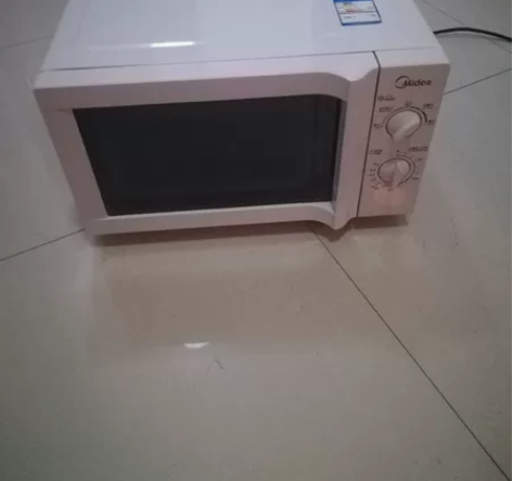 9成新美的微波炉,实物拍摄,非常好,热的快...
